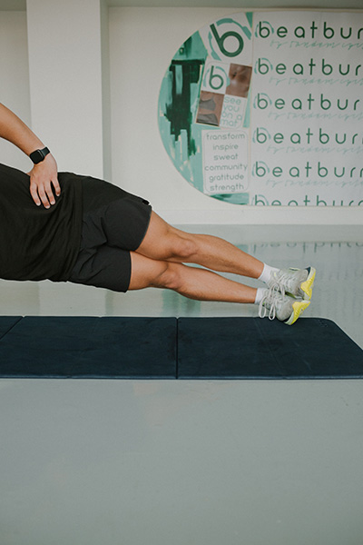 man doing side plank at Tandem Movement